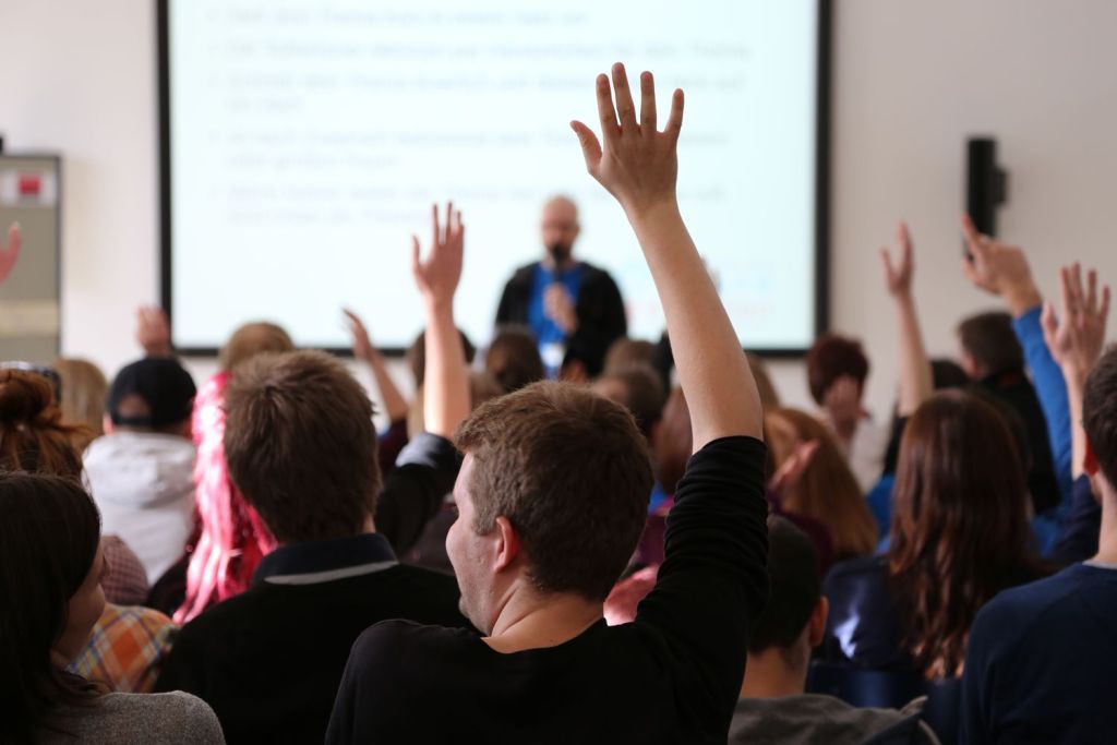 students-raising-hands-during-seminar-683867993-5c85ed0ec9e77c0001a67683.jpg